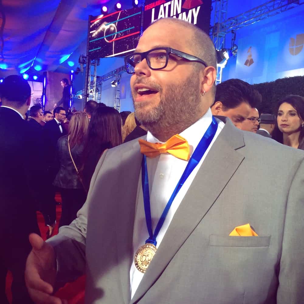 Jon Rezin holding the Grammy Award